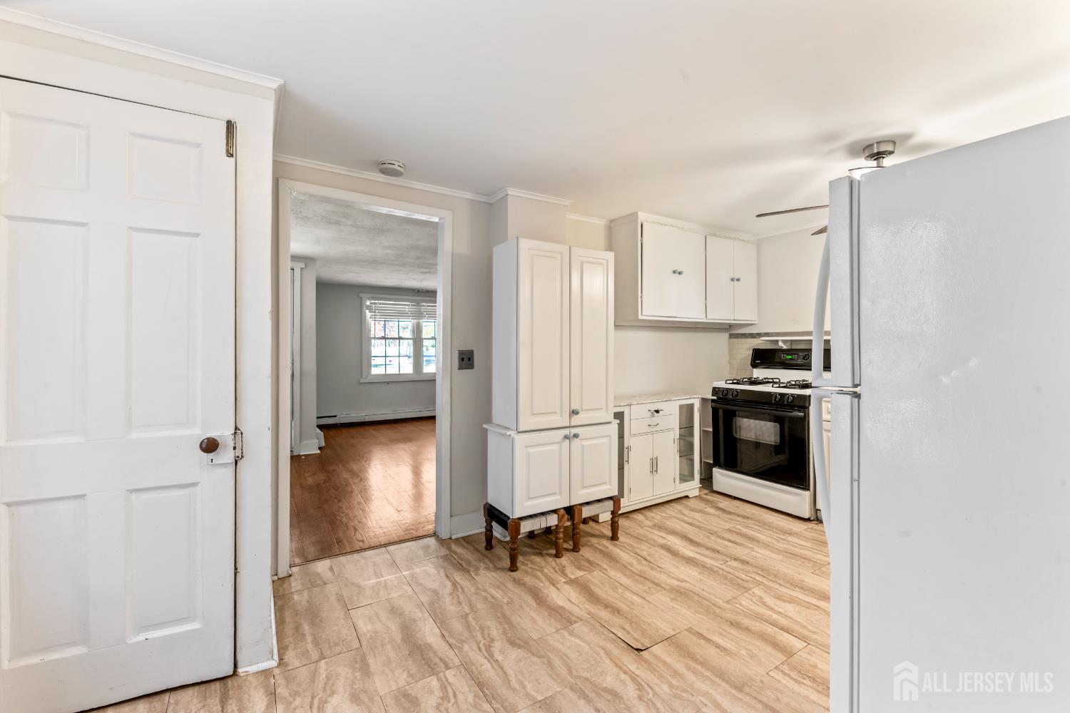 45 Loring Avenue Edison, NJ 08817 - Photo 8 of 23 a view of kitchen and wooden floor