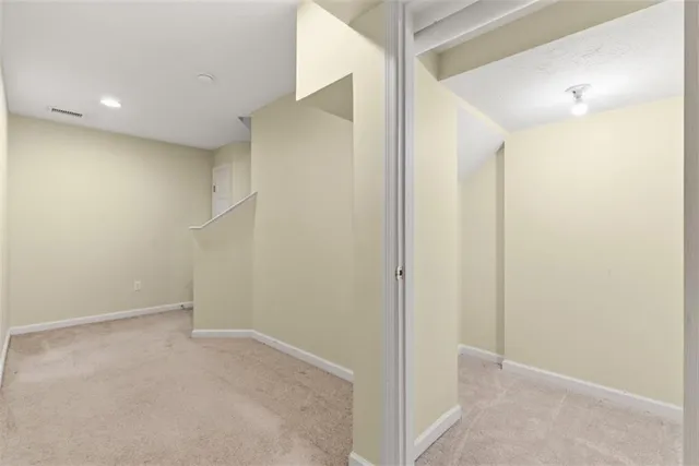 a view of a house with a yard and deck