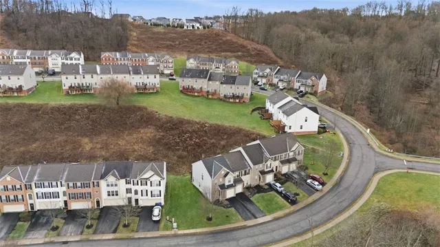 a picture of a room with a refrigerator and a white wall