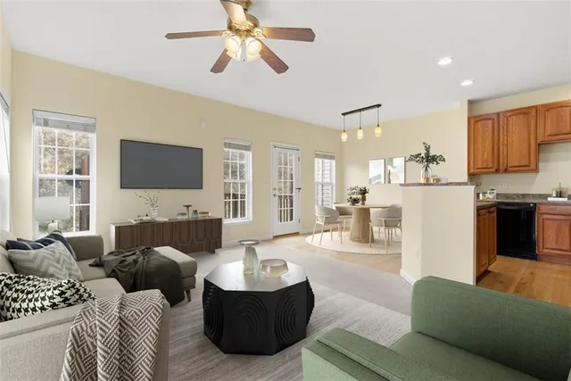 a living room with furniture and a flat screen tv
