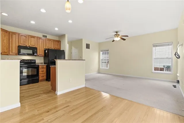 a view of a kitchen with microwave and cabinets