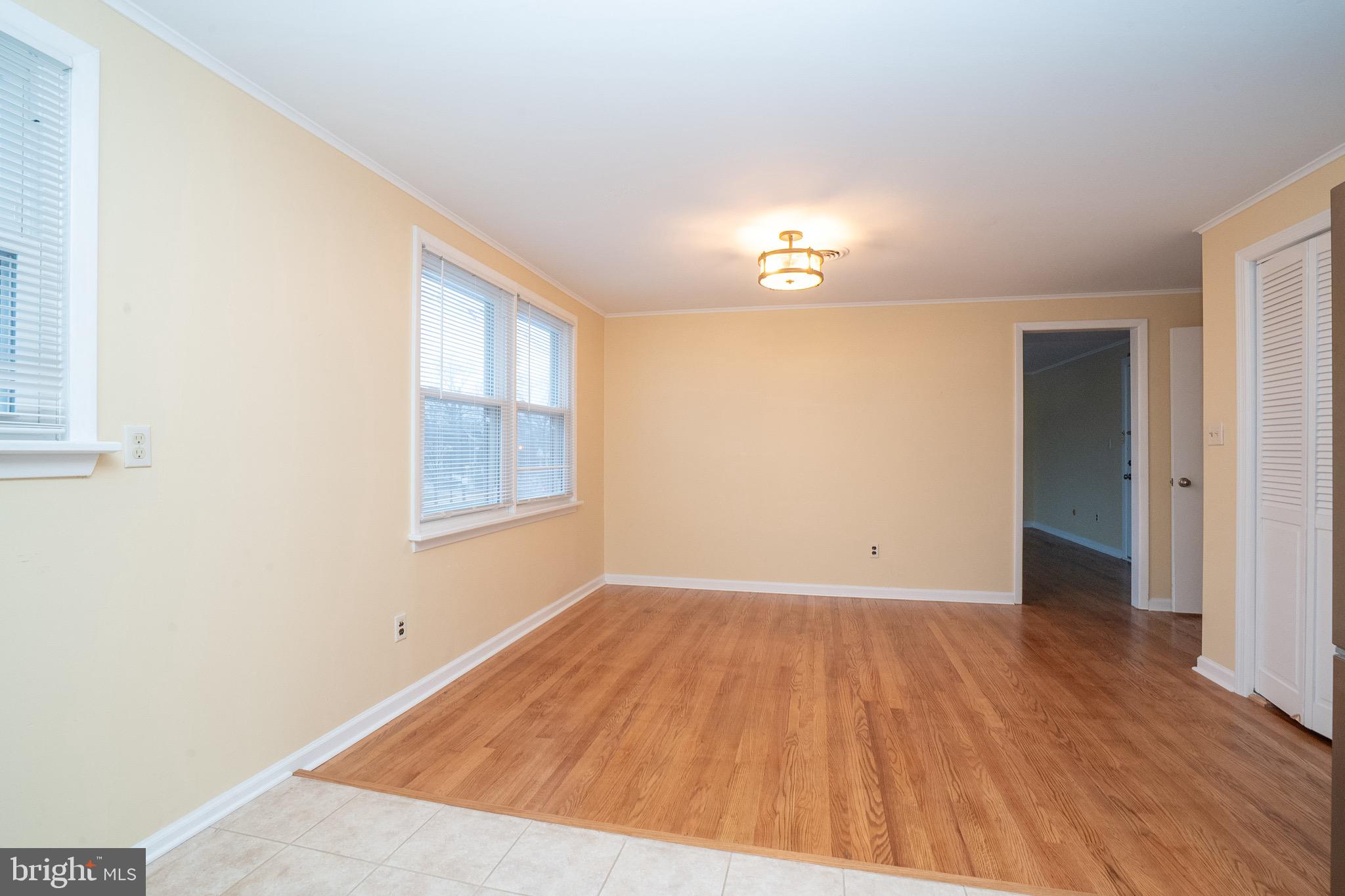 15 Cranbury Road, Unit 1 Princeton Junction, NJ 08550 - Photo 10 of 18 a view of empty room with wooden floor and fan