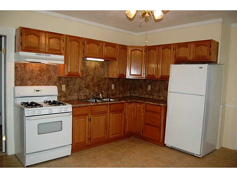 185 Church Street Woonsocket, RI 02895 - Photo 6 of 6 Kitchen. Generous amount of cabinets. Appliances remain