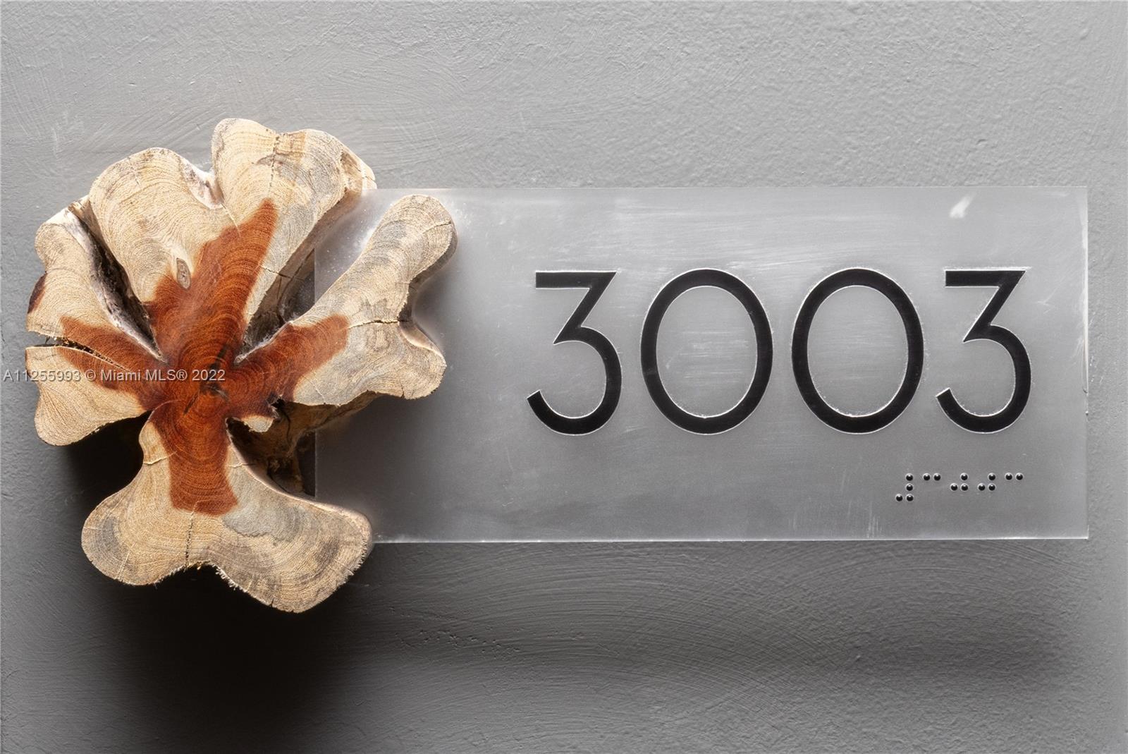 a bathroom with a light fixture and a sink
