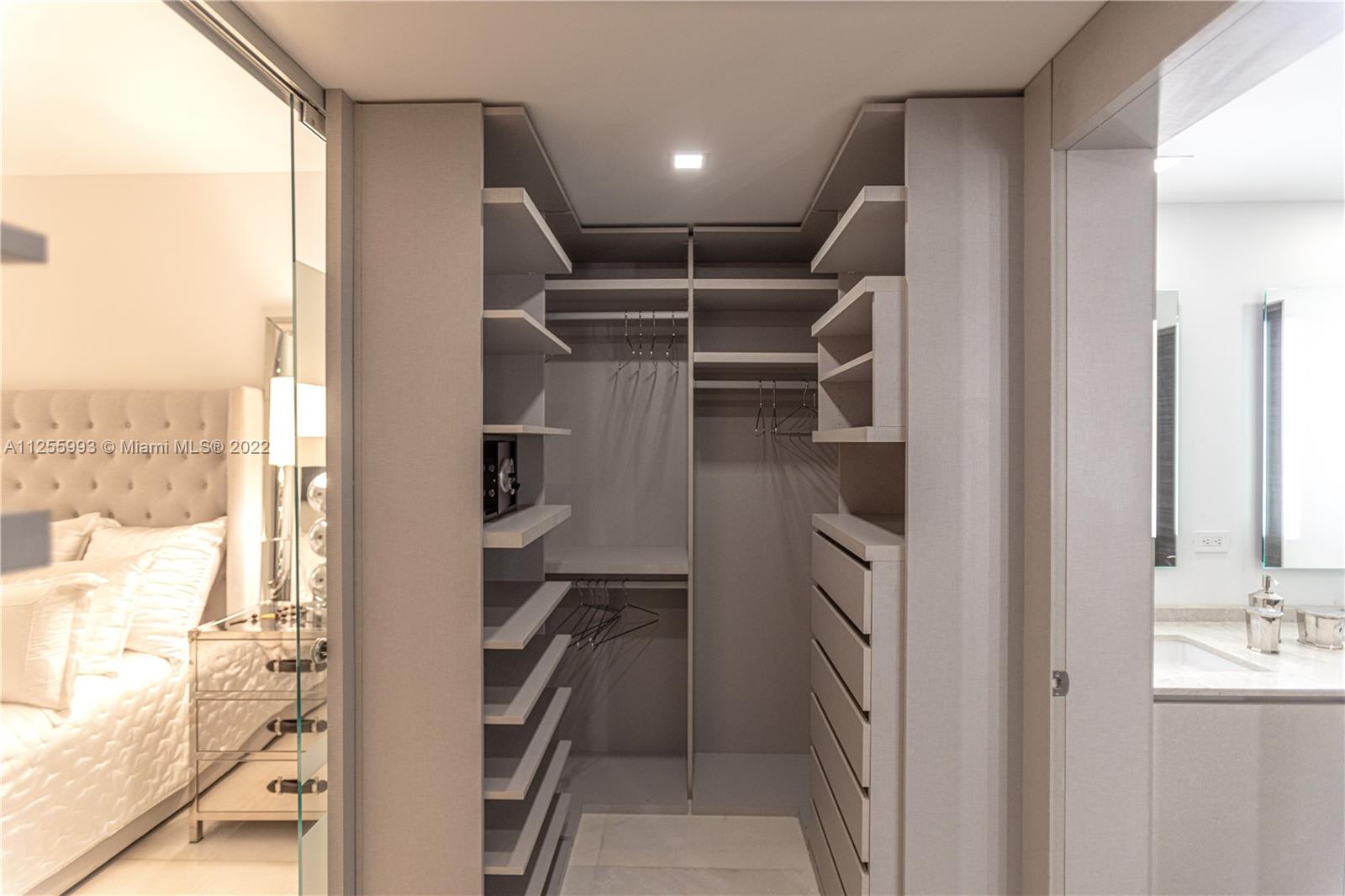 1010 Brickell Avenue, Unit 3003 Miami, FL 33131 - Photo 17 of 32 a view of walk in closet with empty racks