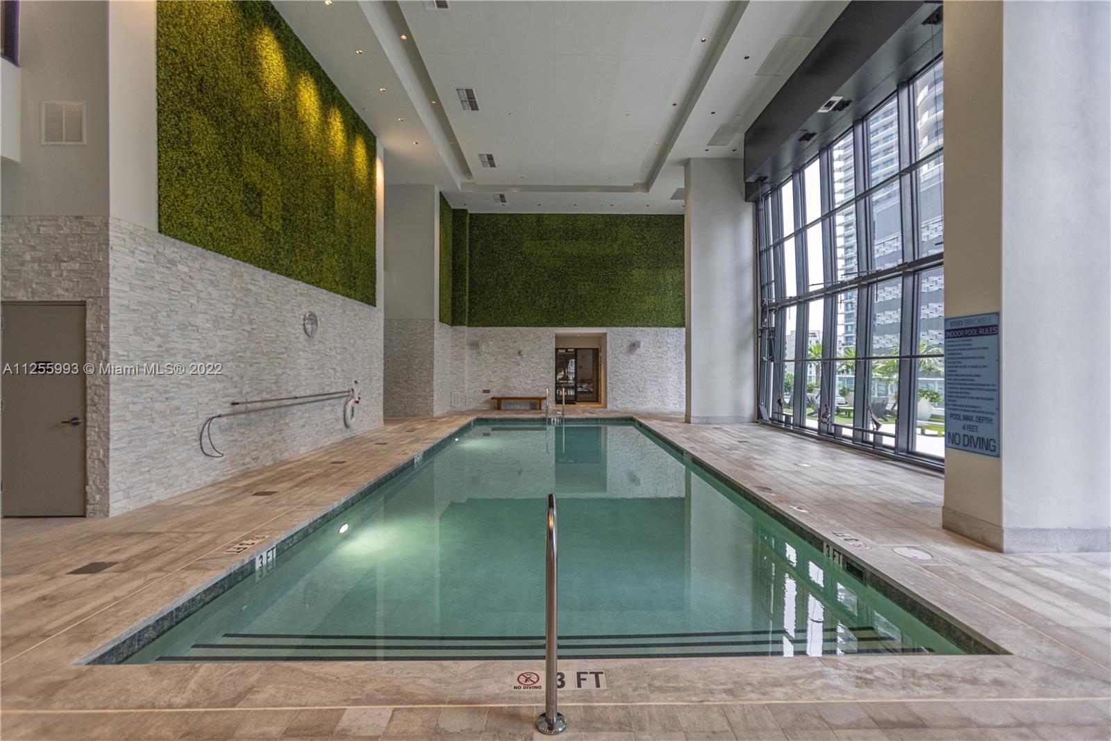 1010 Brickell Avenue, Unit 3003 Miami, FL 33131 - Photo 26 of 32 a kitchen with a sink and a large window