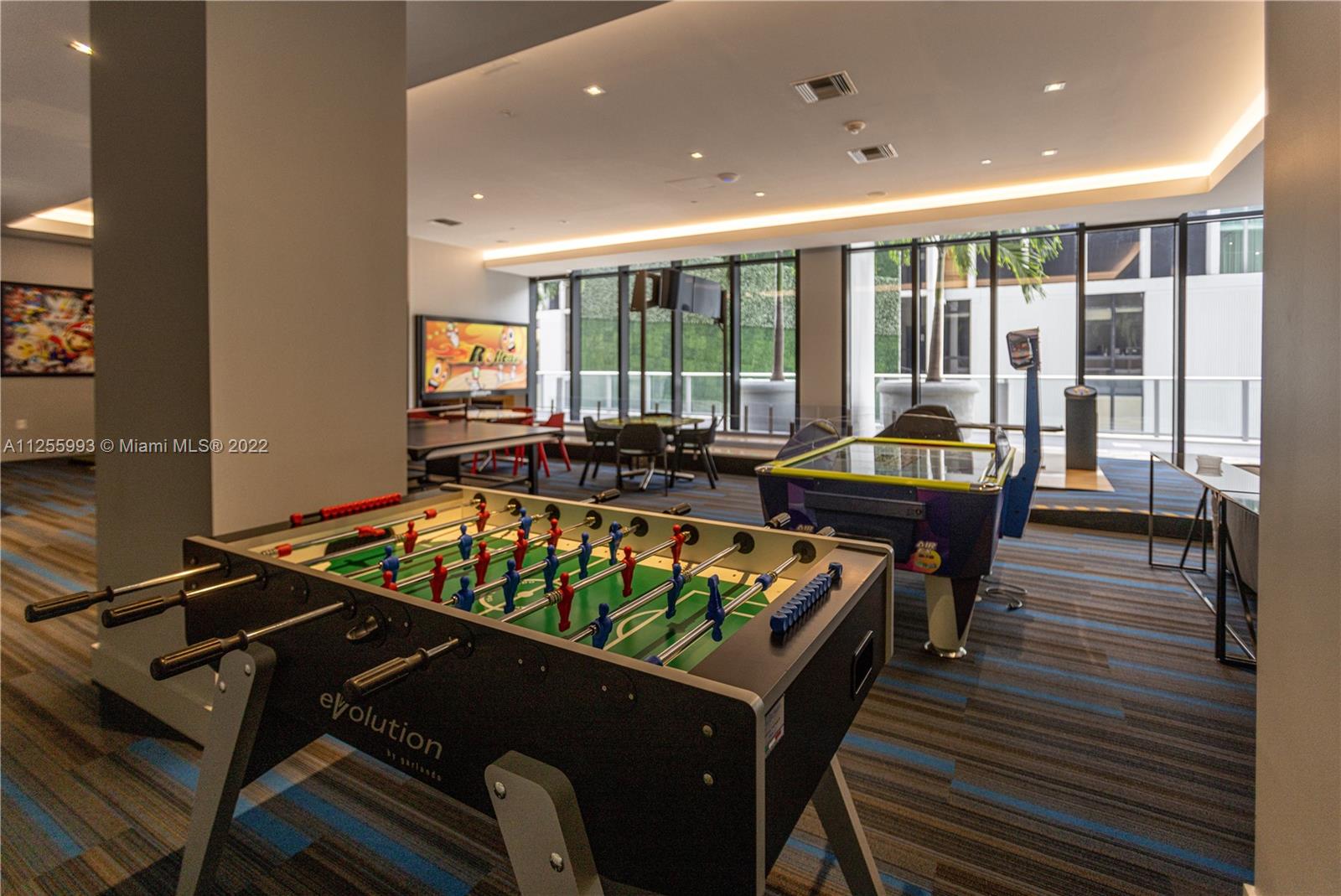 1010 Brickell Avenue, Unit 3003 Miami, FL 33131 - Photo 30 of 32 a living room with furniture pool and wooden floor