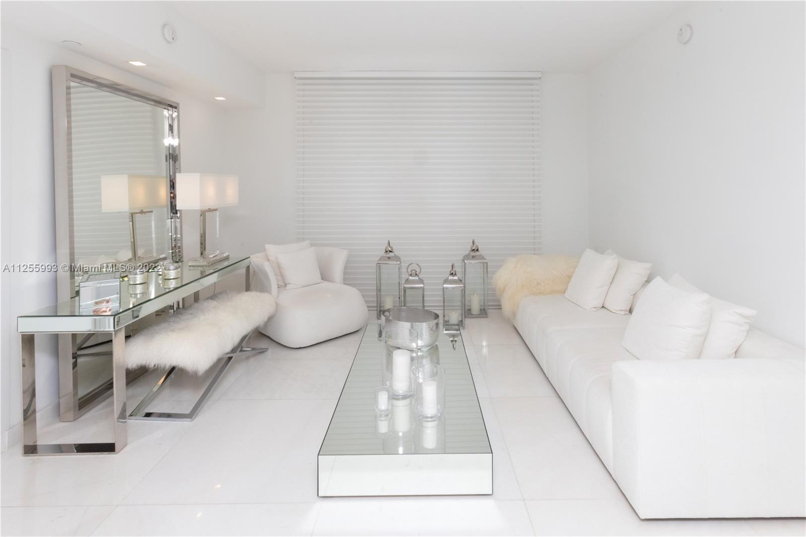 1010 Brickell Avenue, Unit 3003 Miami, FL 33131 - Photo 3 of 32 a living room with furniture and a table