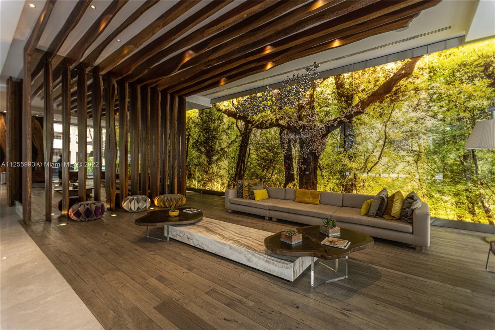 1010 Brickell Avenue, Unit 3003 Miami, FL 33131 - Photo 31 of 32 a building outdoor space with patio furniture and wooden floor