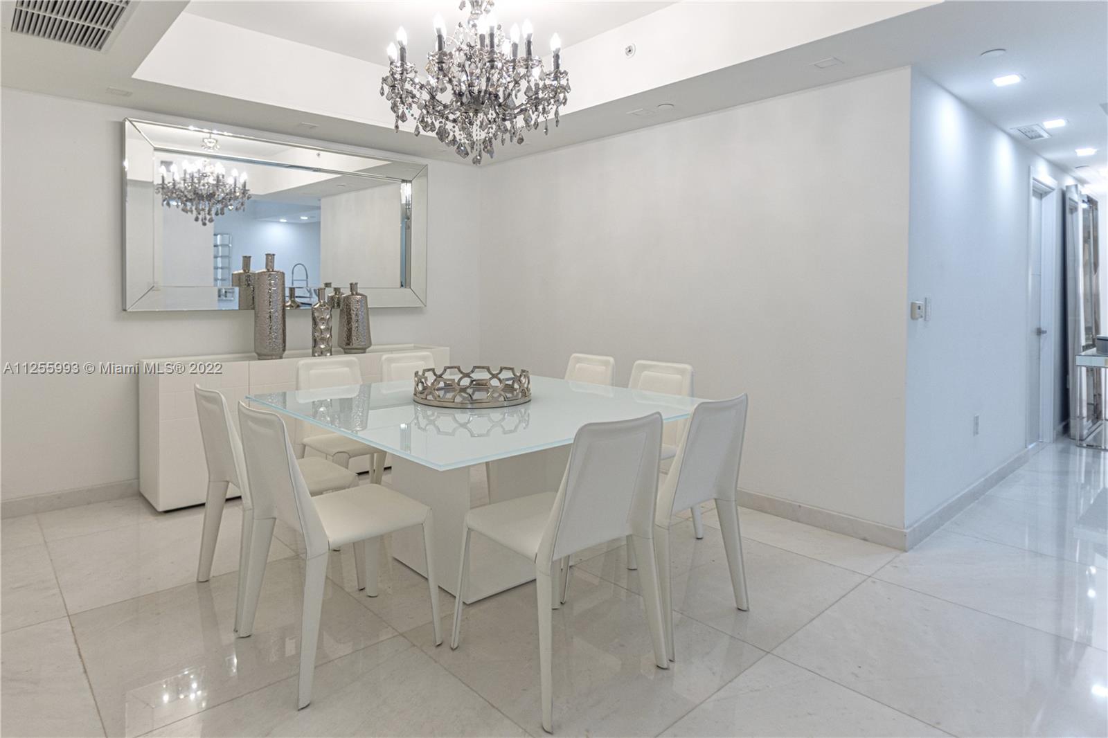 1010 Brickell Avenue, Unit 3003 Miami, FL 33131 - Photo 7 of 32 a view of a dining room with furniture