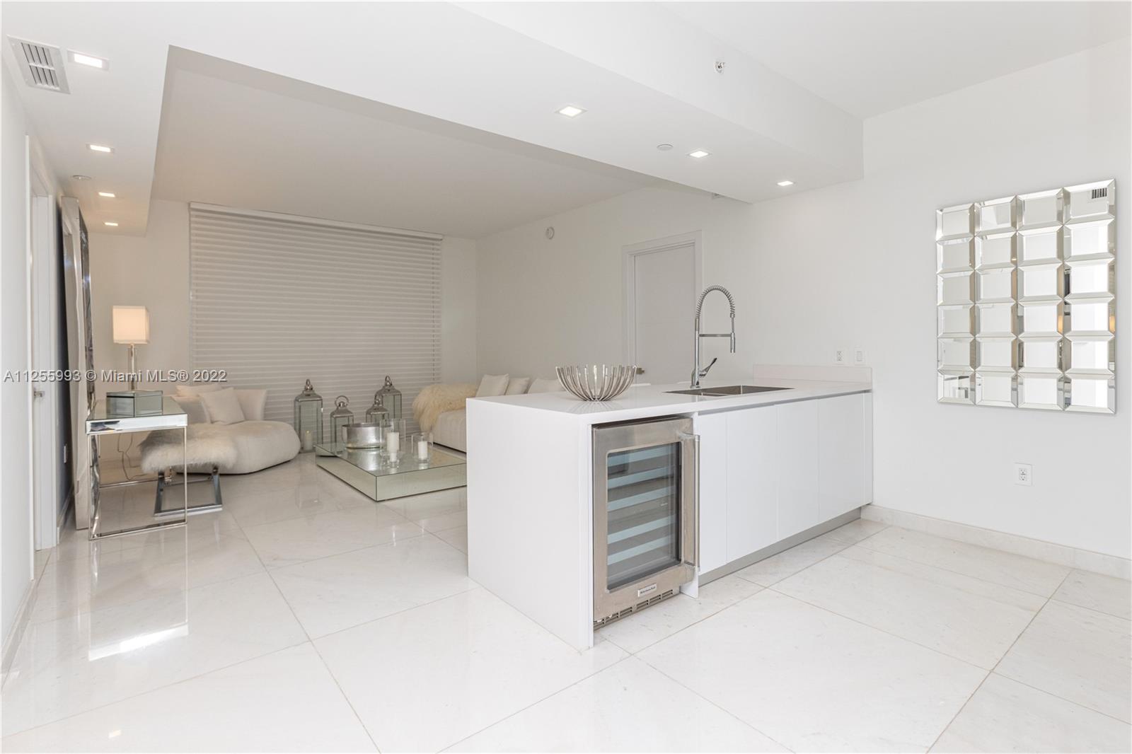 1010 Brickell Avenue, Unit 3003 Miami, FL 33131 - Photo 9 of 32 a bathroom with a sink and a mirror