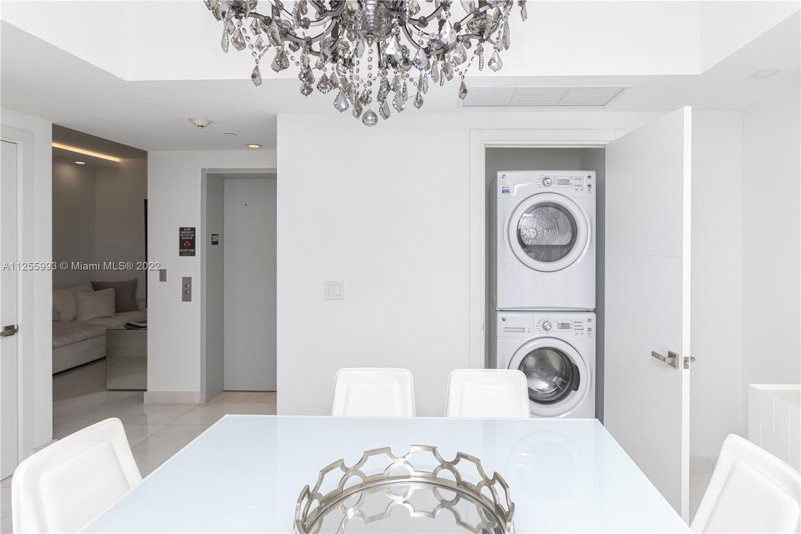 1010 Brickell Avenue, Unit 3003 Miami, FL 33131 - Photo 10 of 32 a bedroom with a bed and a couch