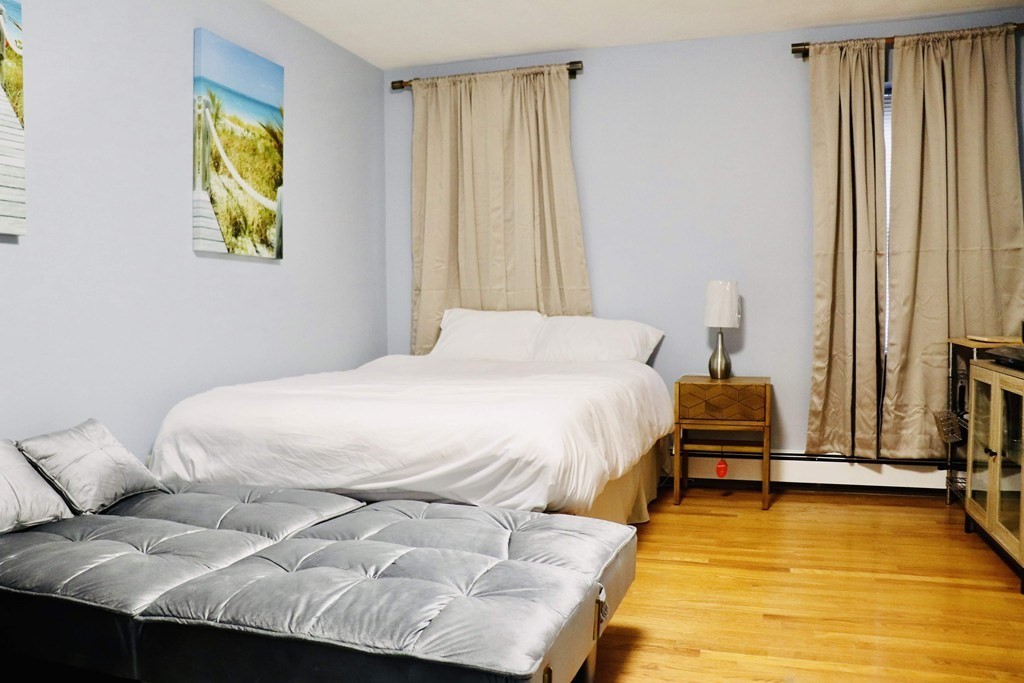 12 Regent Street, Unit 2 Cambridge, MA 02140 - Photo 27 of 42 a bedroom with a bed and a window