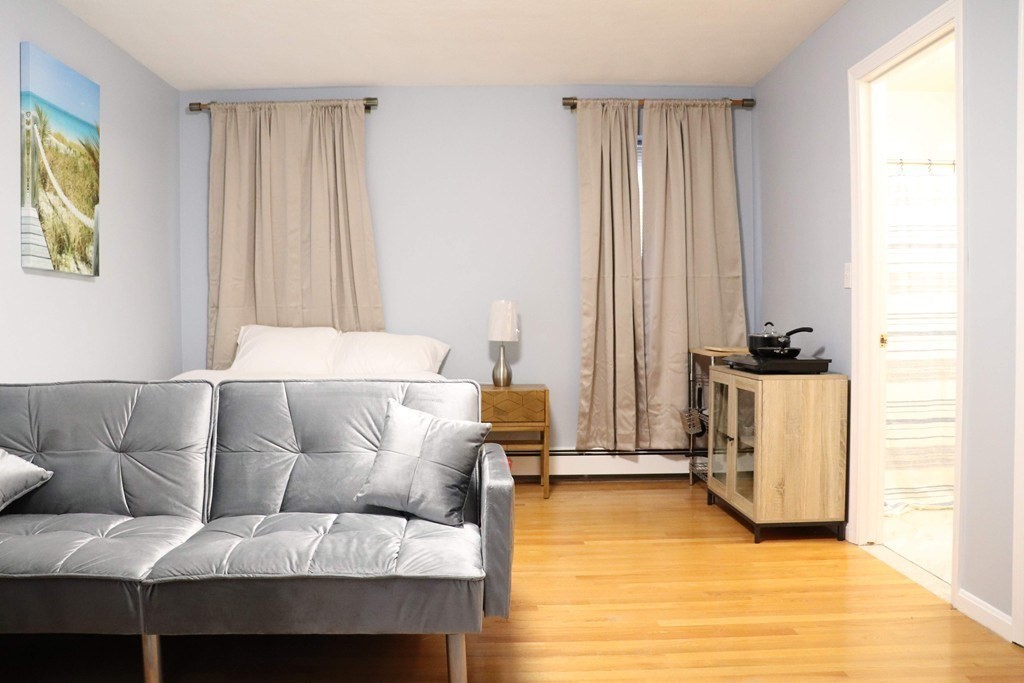 12 Regent Street, Unit 2 Cambridge, MA 02140 - Photo 41 of 42 a living room with furniture and a window