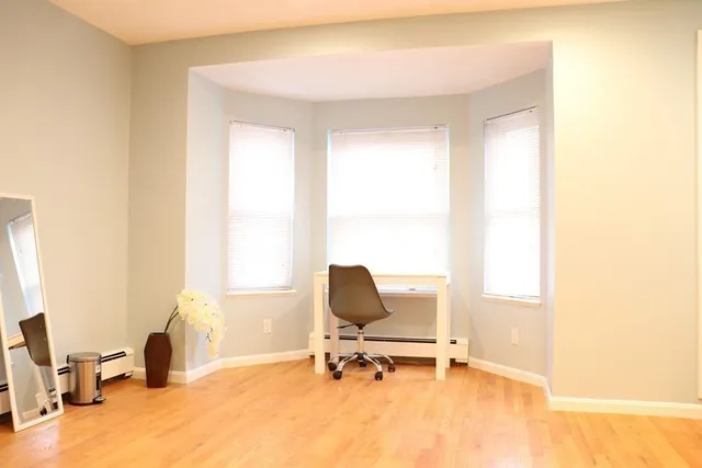 a room with chair and a window