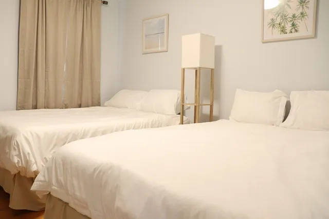 a large bed with a white comforter