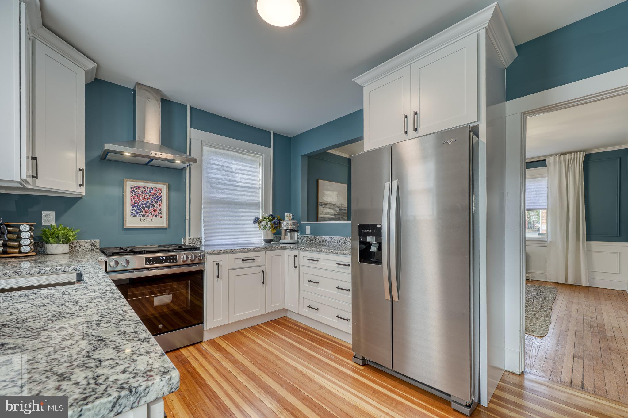 606 Aldershot Road Baltimore, MD 21229 - Photo 21 of 52 a kitchen with a refrigerator stove and sink