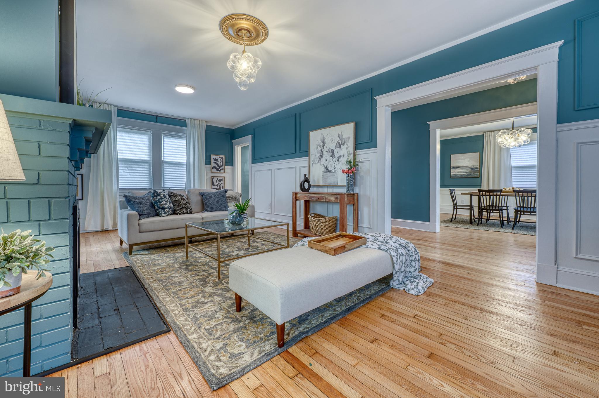 606 Aldershot Road Baltimore, MD 21229 - Photo 32 of 52 a living room with furniture and a wooden floor