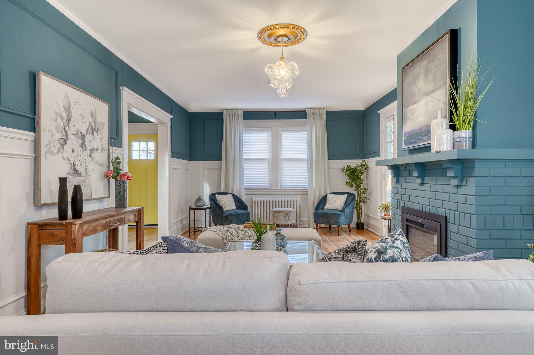 606 Aldershot Road Baltimore, MD 21229 - Photo 33 of 52 a living room with fireplace furniture and a window
