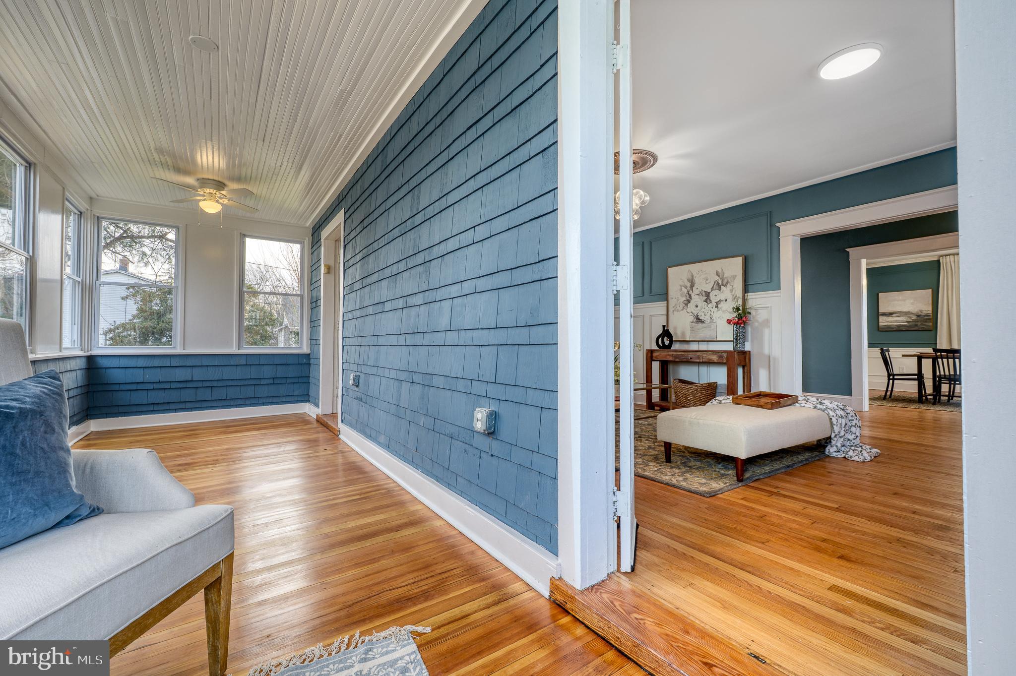 606 Aldershot Road Baltimore, MD 21229 - Photo 39 of 52 a bedroom with furniture and a wooden floor
