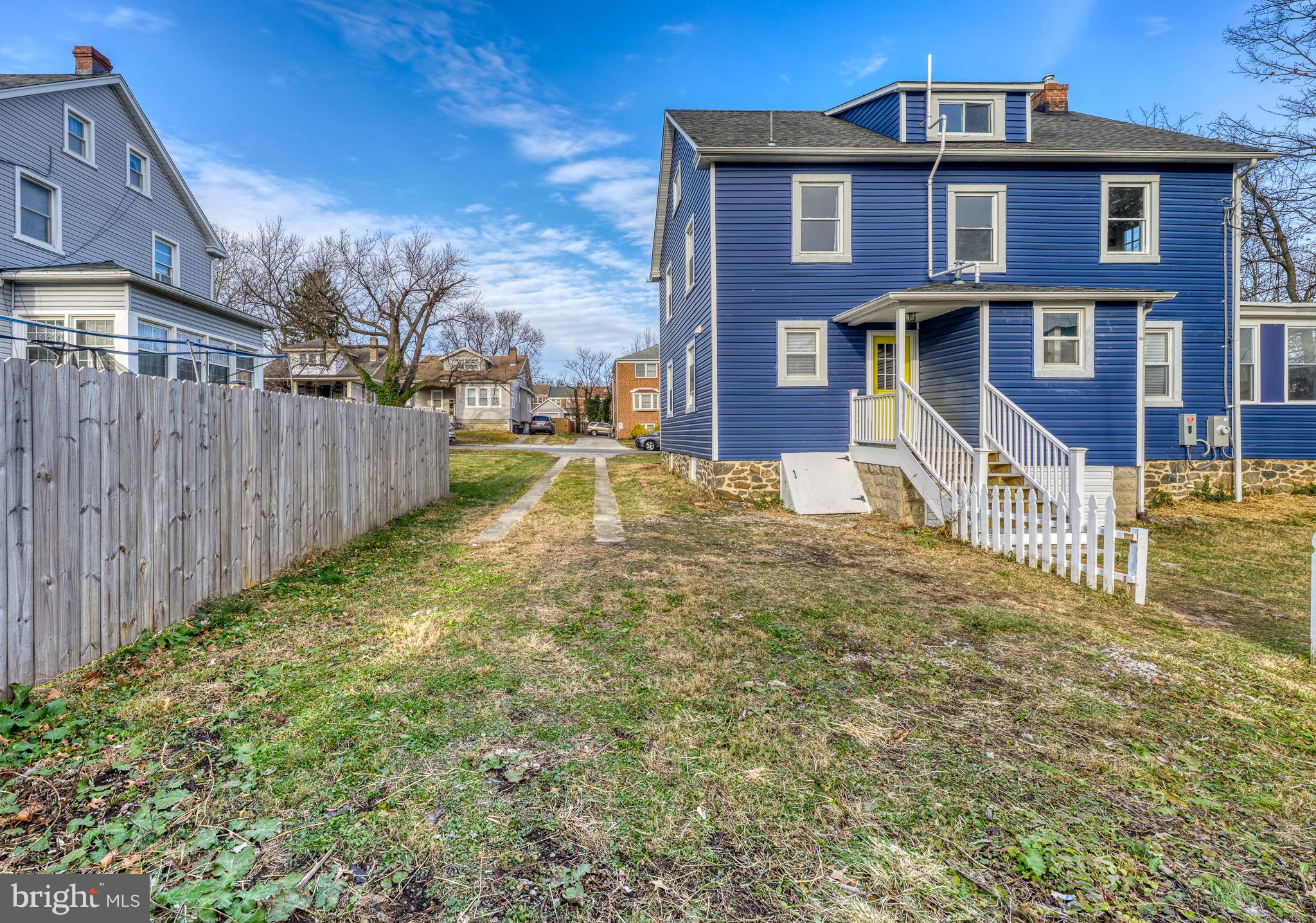 606 Aldershot Road Baltimore, MD 21229 - Photo 45 of 52 a view of a brick house with a yard