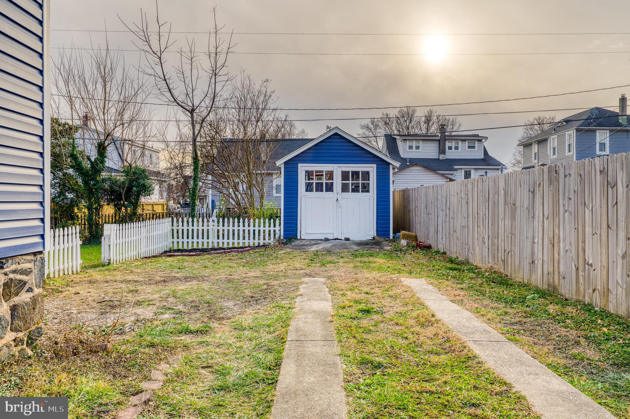 606 Aldershot Road Baltimore, MD 21229 - Photo 51 of 52 a view of a yard with wooden fence