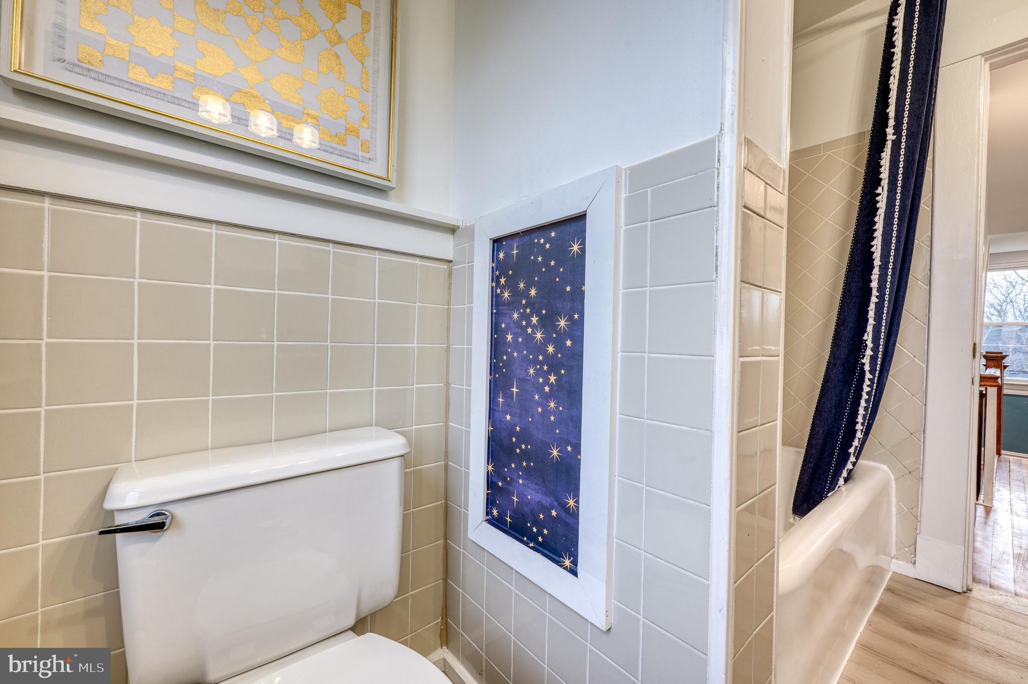 606 Aldershot Road Baltimore, MD 21229 - Photo 8 of 52 a bathroom with a toilet and shower