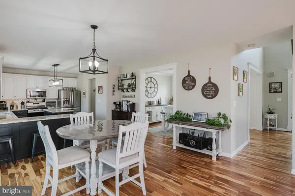 a kitchen with stainless steel appliances a stove a sink and a microwave