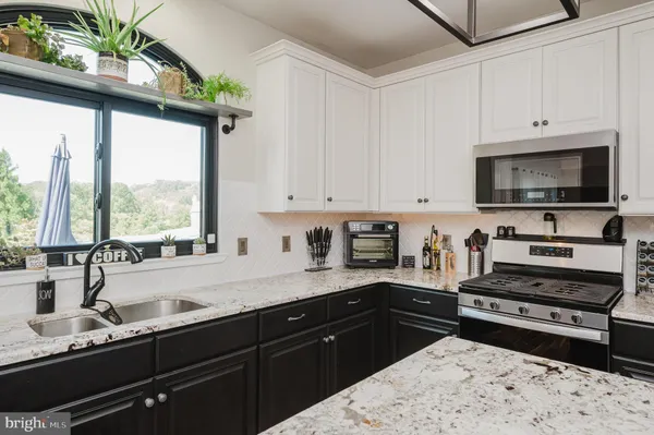 a view of a balcony with wooden floor and fence