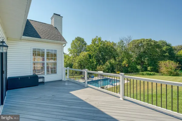 a view of a livingroom with furniture and stairs