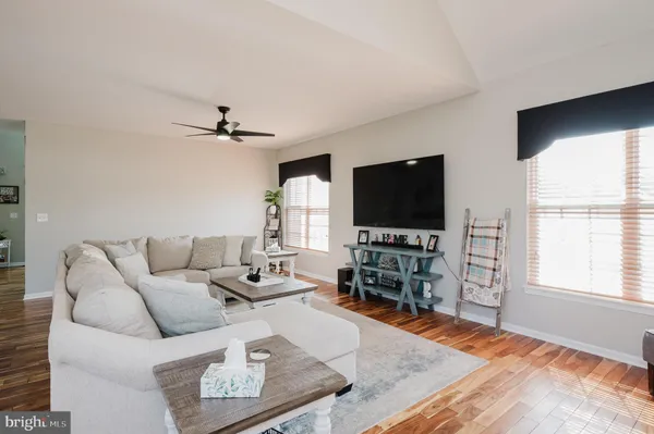 a bathroom with a bathtub sink and mirror