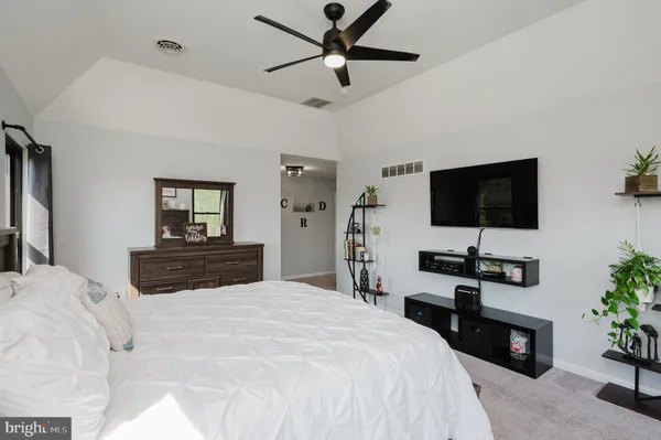 a kitchen with a sink and white cabinets