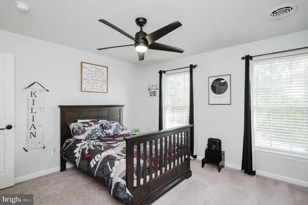 an aerial view of a house with a garden and swimming pool
