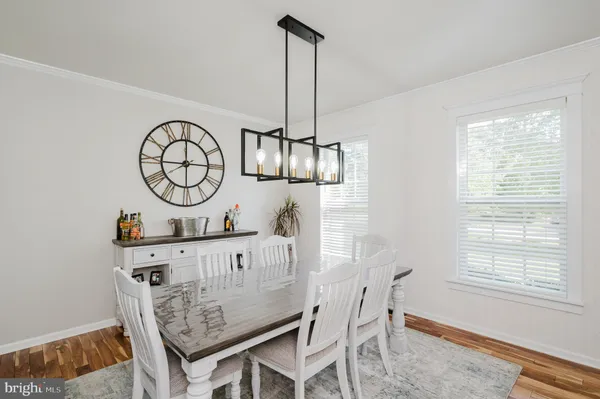 a view of dining room and hall with furniture