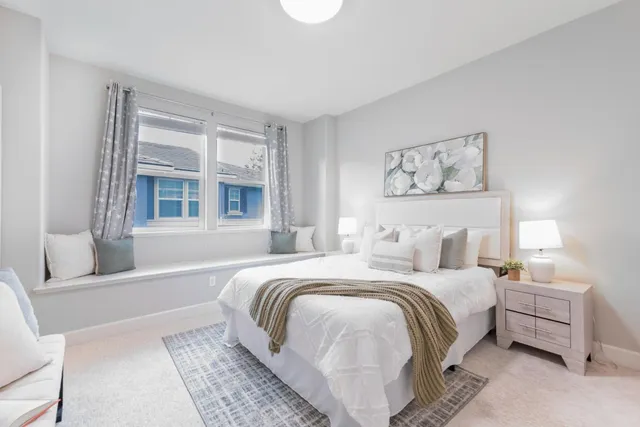 a bedroom with a bed and a couch