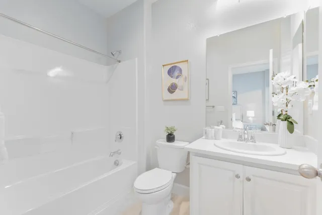 a bedroom with a bed and a table