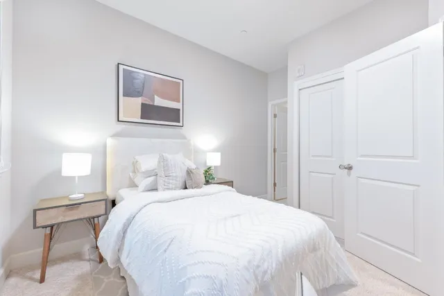 a white toilet sitting next to a bathroom sink