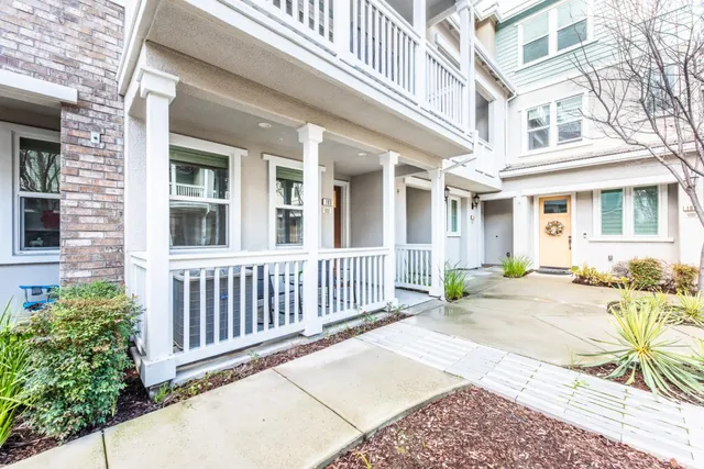 a view of a brick building next to a yard