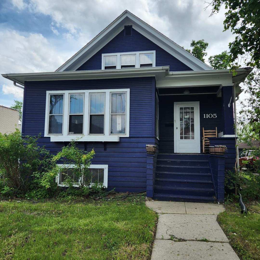 1105 West Touhy Avenue, Unit 2 Park Ridge, IL 60068 - Photo 1 of 2 a view of front of a house with a yard