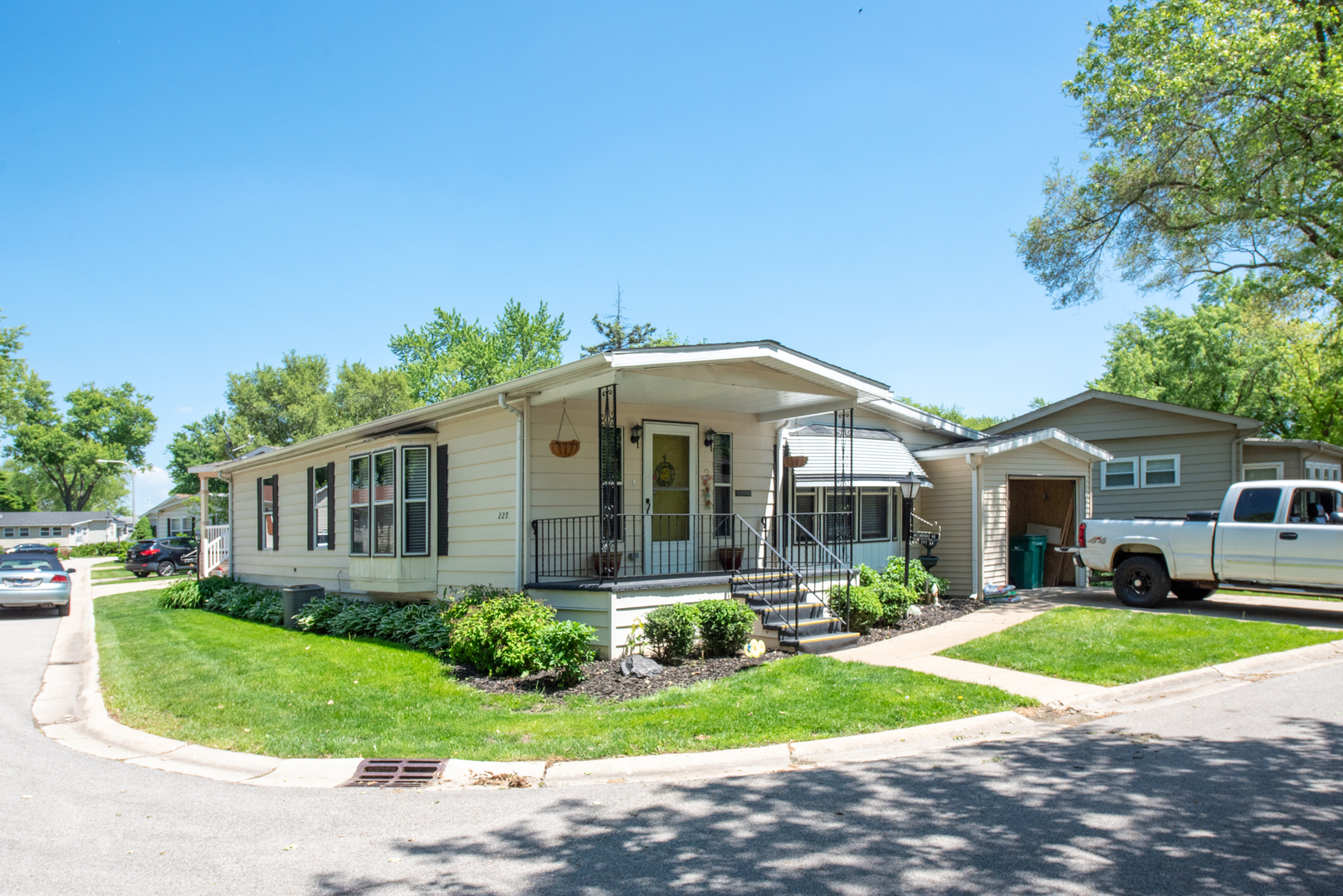 225 Melbrooke Road Elgin, IL 60123 - Photo 1 of 30 a front view of a house with a yard and potted plants