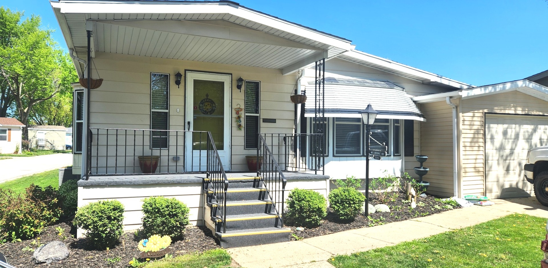 225 Melbrooke Road Elgin, IL 60123 - Photo 2 of 30 a front view of a house with a yard