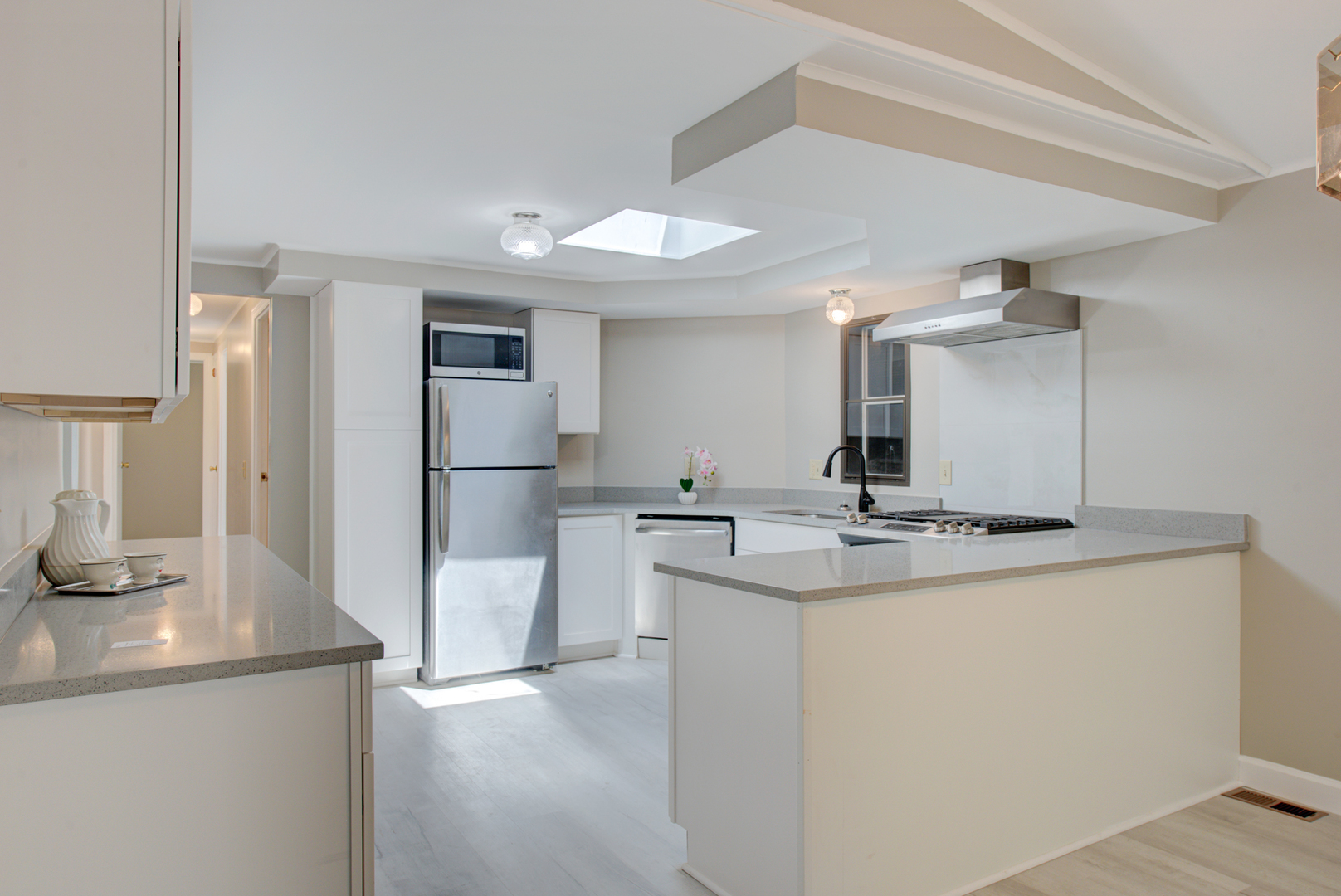 225 Melbrooke Road Elgin, IL 60123 - Photo 3 of 30 a kitchen with stainless steel appliances granite countertop a sink and a refrigerator
