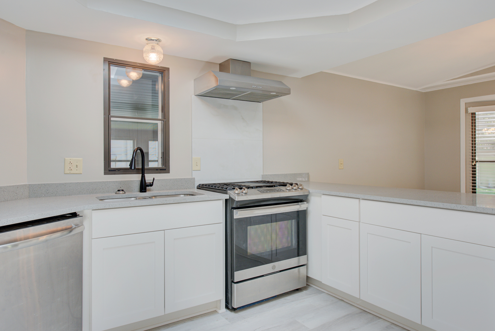 225 Melbrooke Road Elgin, IL 60123 - Photo 6 of 30 a kitchen with white cabinets stainless steel appliances and sink