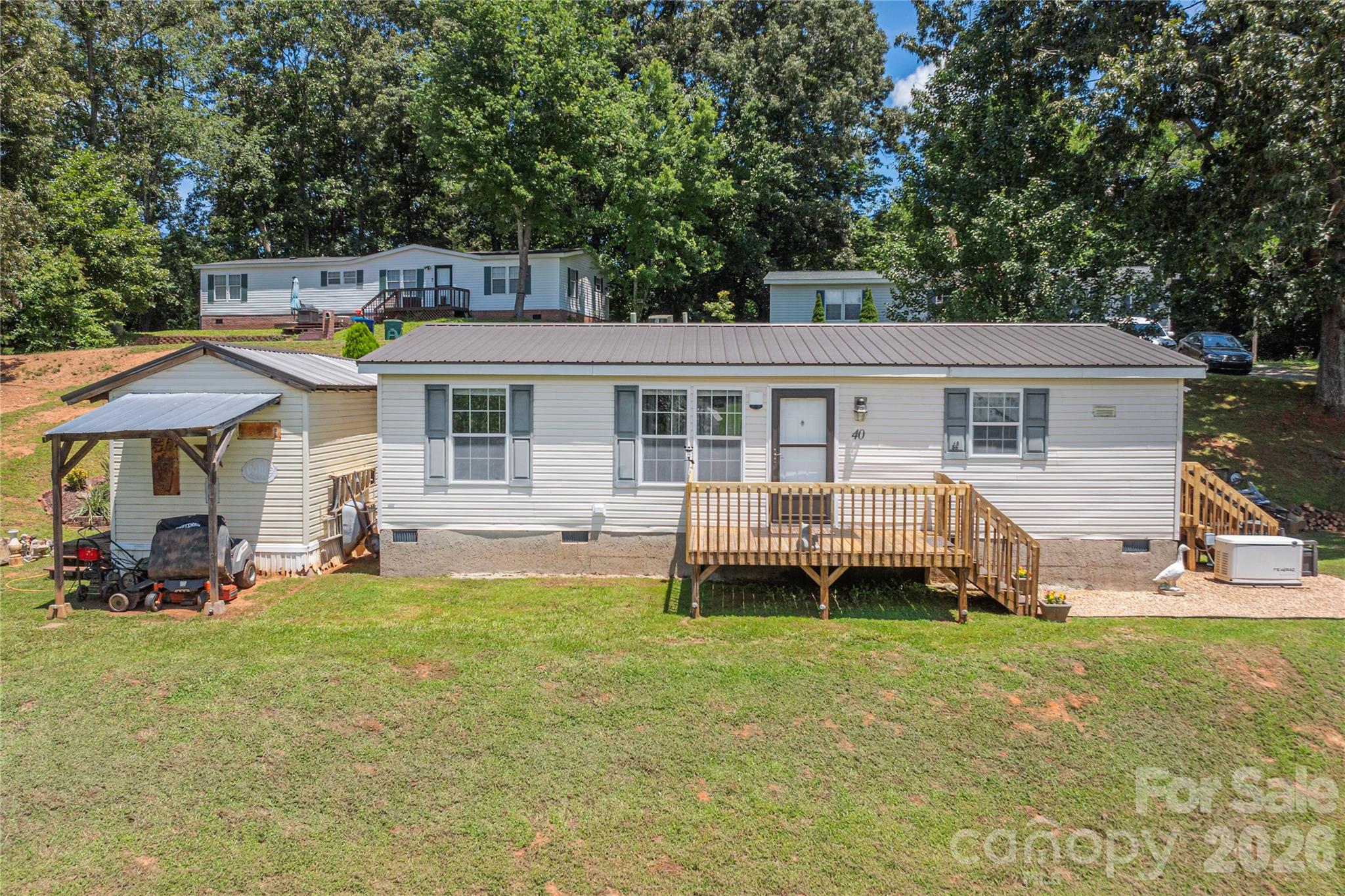40 Farmstead Road Leicester, NC 28748 - Photo 2 of 29 a view of a house with a yard and sitting area