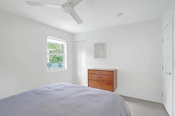 a room with a bed and a cabinets
