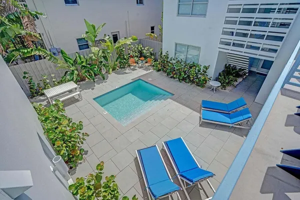 a view of a chair and table in the patio