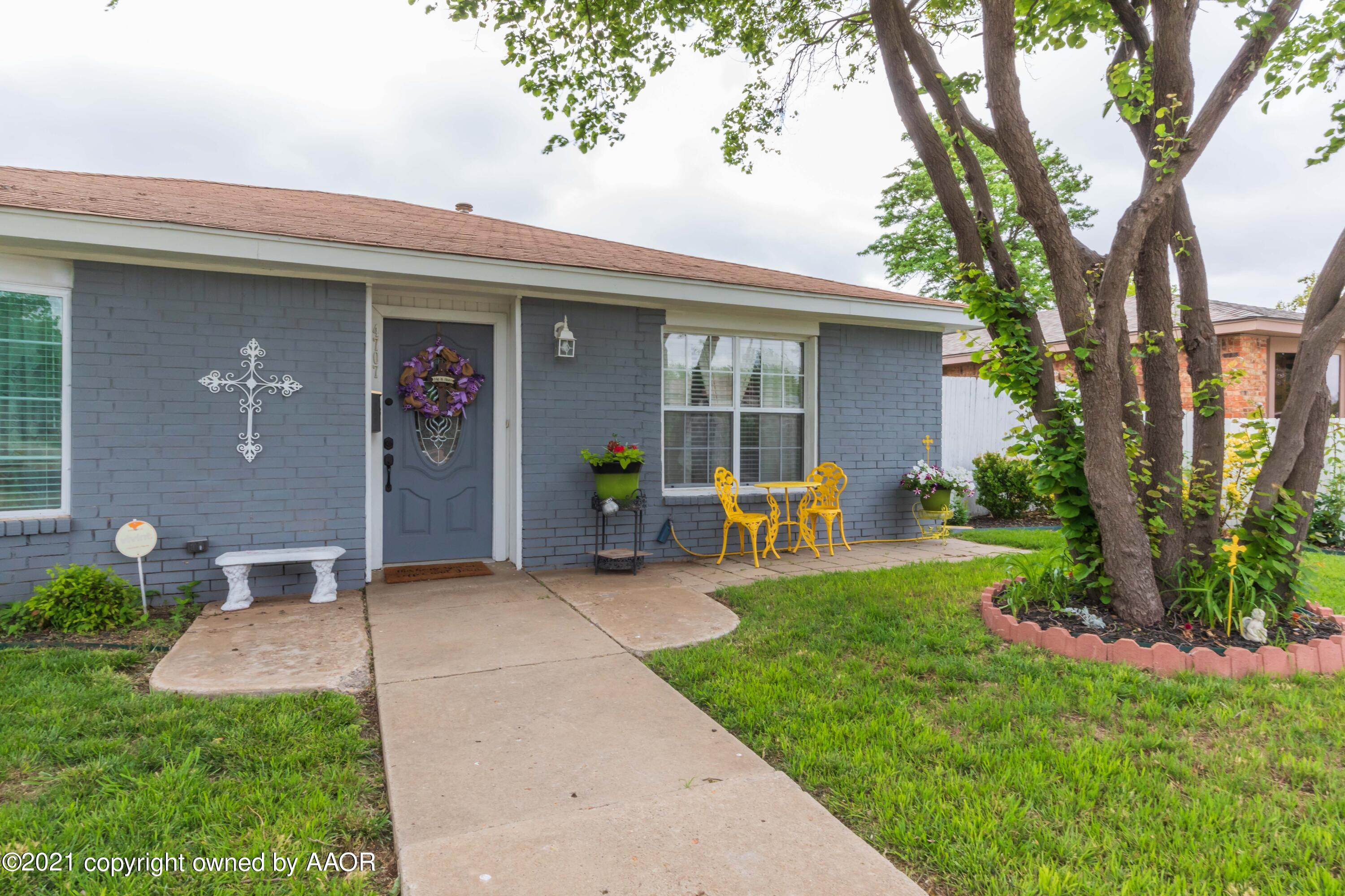 4707 Journey Street Amarillo, TX 79110 - Photo 2 of 65 a view of a house with backyard and porch