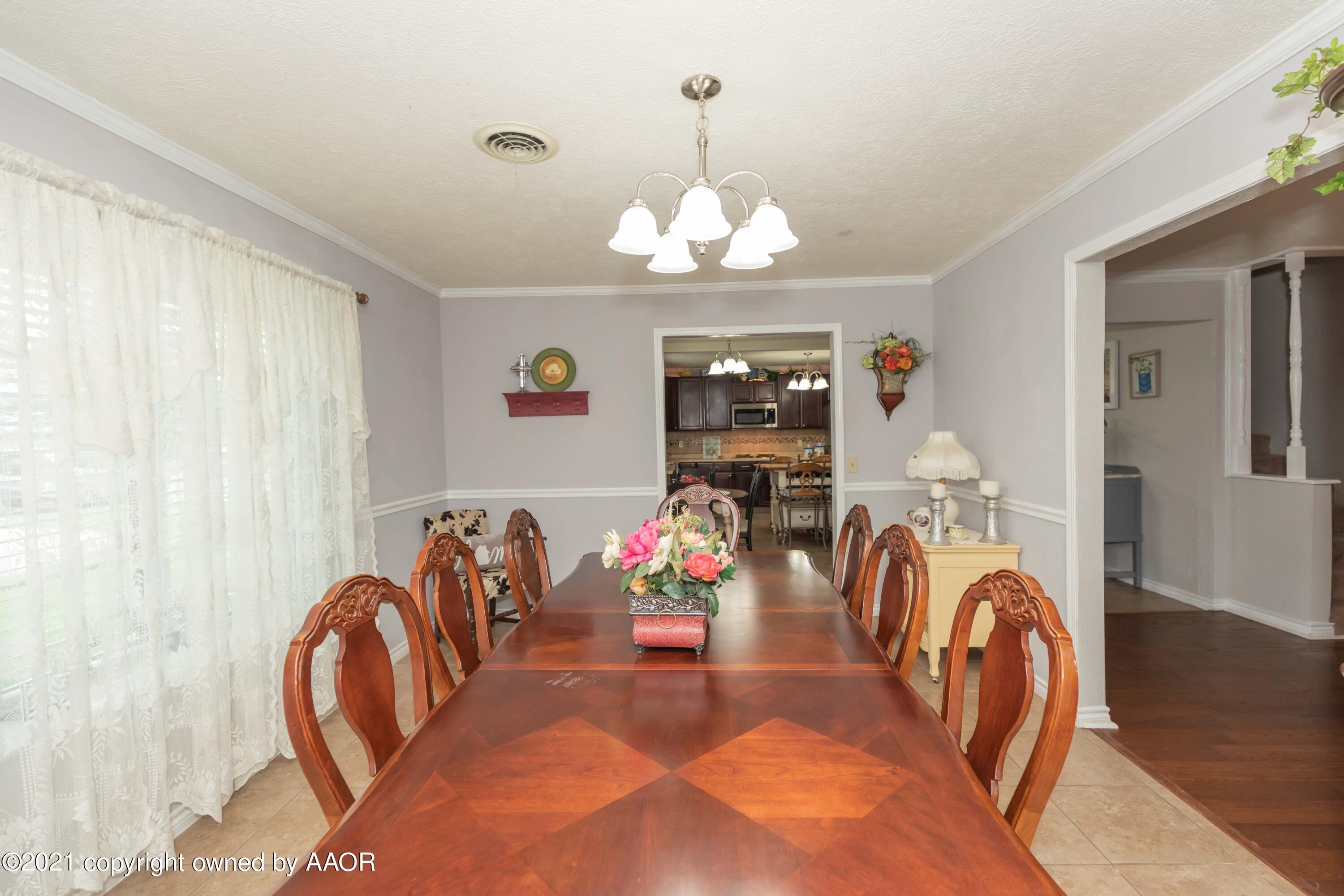 4707 Journey Street Amarillo, TX 79110 - Photo 20 of 65 a view of a livingroom with furniture and chandelier
