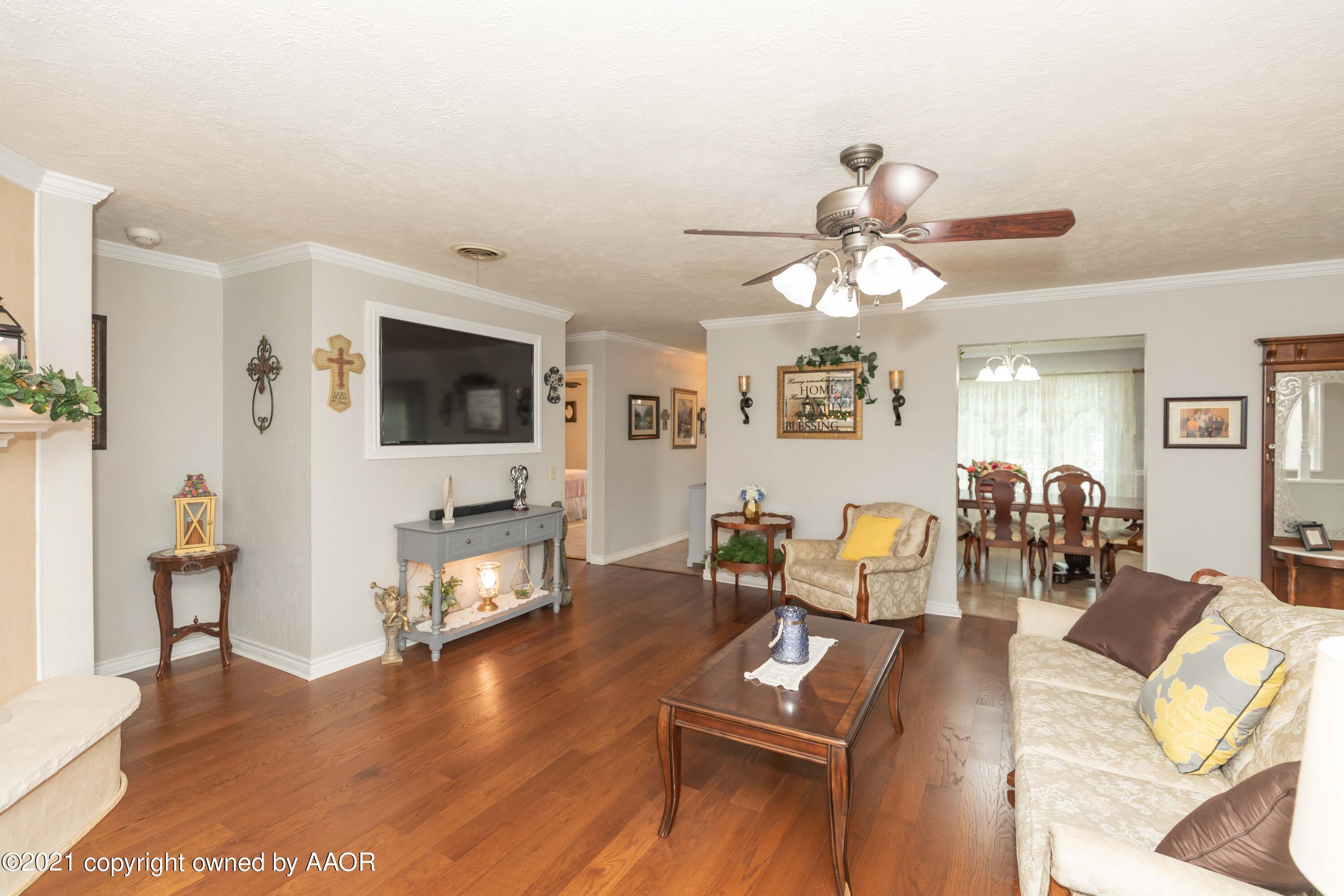4707 Journey Street Amarillo, TX 79110 - Photo 24 of 65 a living room with furniture and a flat screen tv
