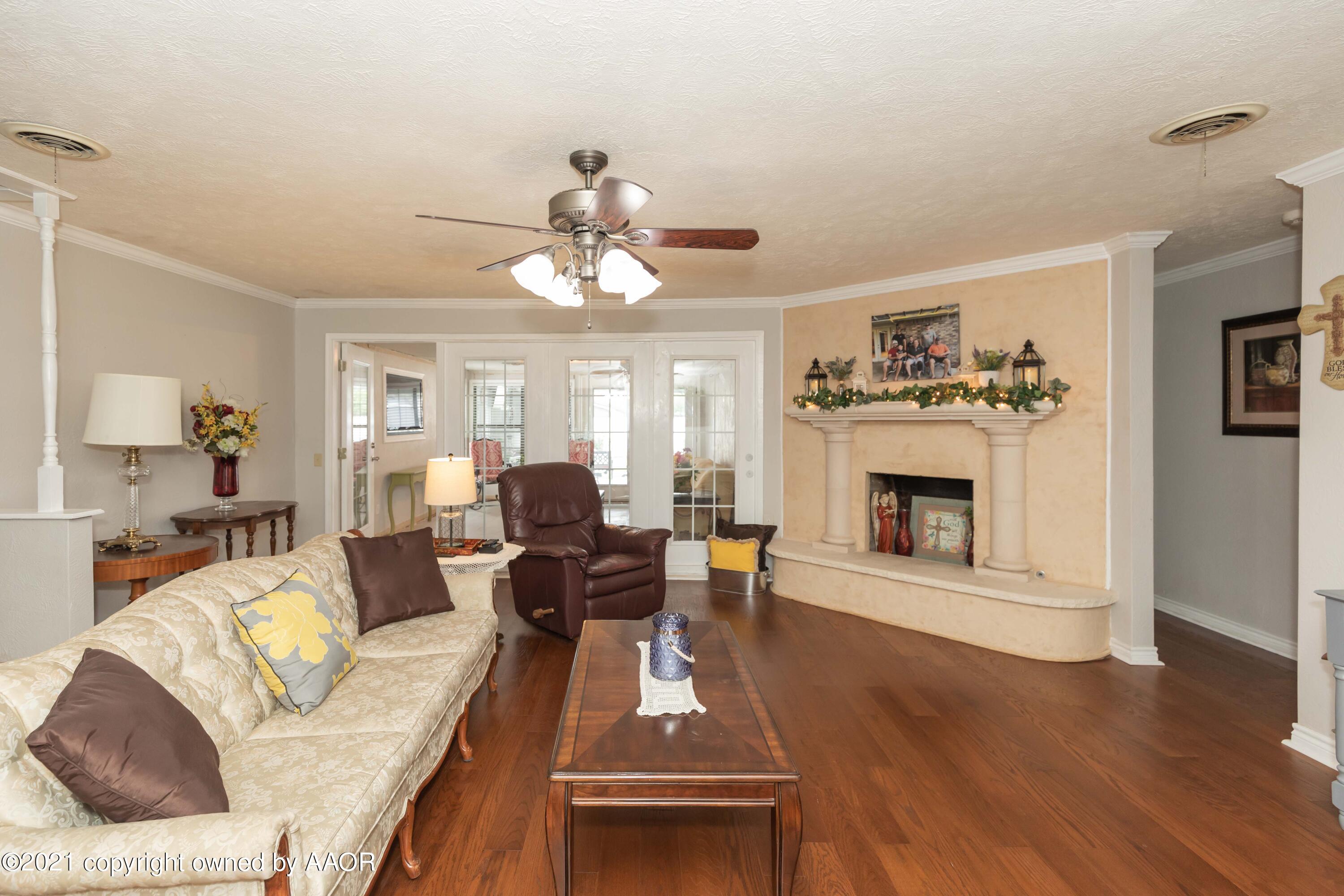 4707 Journey Street Amarillo, TX 79110 - Photo 25 of 65 a living room with furniture fireplace and a table